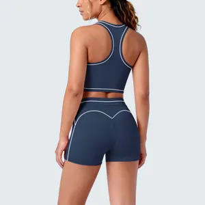 Back detail of contrast piped sports bra and shorts activewear set, stretch fabric.