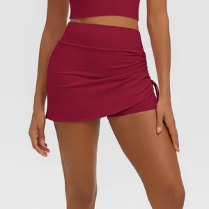 High-waist ruched athletic skirt for women, faux two-piece fitness yoga activewear shorts.