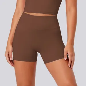High-waisted brown yoga shorts close-up, breathable athletic fitness apparel details.