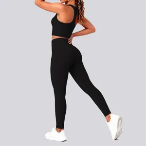 Seamless solid color yoga set with sports bra and high waist leggings for fitness and running.
