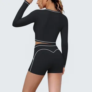 Close-up back view of black long sleeve crop top and shorts activewear yoga set details.