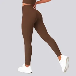 Detail view of brown high waist yoga leggings showing back contour and lift effect.