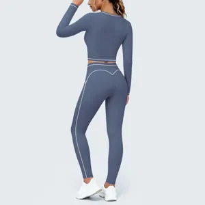 Back view detail showing blue long sleeve crop top yoga set with contrast piping.