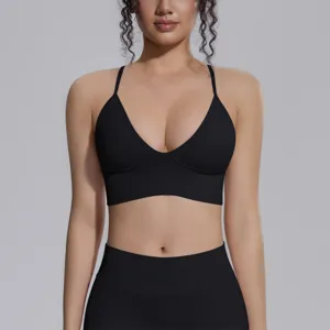 Close-up detail of the black seamless sports bra and high-waisted leggings set.