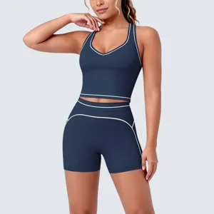 Dark blue contrast trim seamless sports bra and shorts activewear set for fitness and yoga.