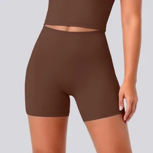 Close-up detail of dark brown high-waisted fitness yoga shorts, breathable fabric.