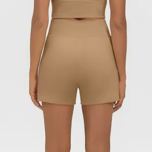 Detailed rear view of high-waisted khaki yoga shorts and crop top athletic fitness set.