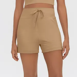 High-waisted athletic shorts with drawstring, side pockets, casual fitness yoga wear details.
