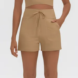 High waist sports shorts with drawstring and side pockets for women fitness workout gym apparel.