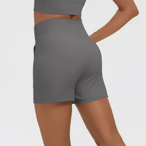 High-waisted athletic shorts for women, solid grey yoga shorts with pockets, gym fitness wear.