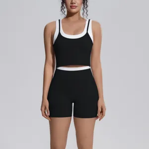 Close-up detail of women contrast color fitness sports vest and shorts workout set.