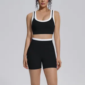 Women colorblock sports bra and biker shorts activewear set for yoga fitness running.