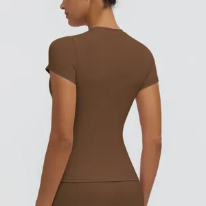 Close-up view of the back and side details of women's brown quick-dry fitness yoga top.