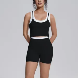 Women's two-piece athletic crop top and shorts activewear set for yoga and fitness.