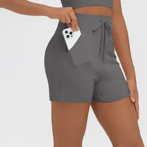 Detail view of high-waisted activewear shorts with convenient side pocket design.