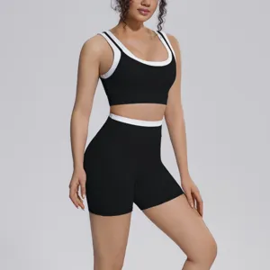 Black contrast sports bra and shorts yoga set for women, breathable fitness workout activewear.