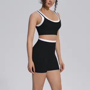 Black contrast activewear set detail featuring a sports bra and high-waist shorts.