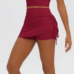 High waist ruched athletic mini skirt with built-in shorts for women yoga gym fitness.