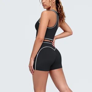 Detail angle showcasing the black contrast racerback yoga fitness set with stylish white piping.