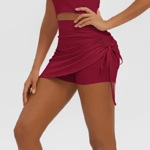 High-waist ruched yoga skirt shorts activewear detail view, breathable stretch fitness apparel.