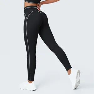 Mallas de yoga negras de talle alto para mujer con ribete blanco contrastante para fitness.