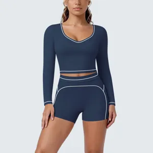 Dark blue contrast piping long sleeve crop top and shorts yoga set activewear detail view