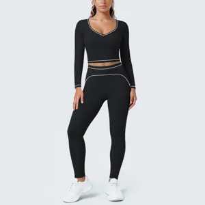 Black long sleeve crop top yoga set with white contrast piping for women gym fitness workout.