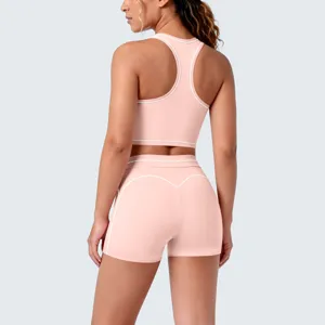 Pink contrast piping sports bra and shorts athletic two-piece yoga set back view detail.