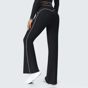 Black high-waisted flared yoga pants with contrast piping details for women activewear.