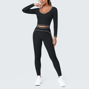 Detailed view of the black contrast piping yoga crop top and leggings fitness workout set.