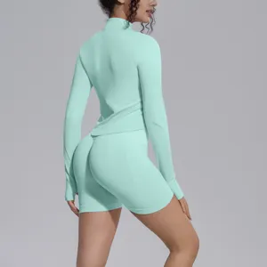 Seamless activewear set mint green long sleeve crop top high waist fitness shorts yoga gym.