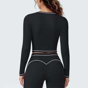 Dames langarm sport crop top en bijpassende leggings set voor fitness yoga hardlopen.