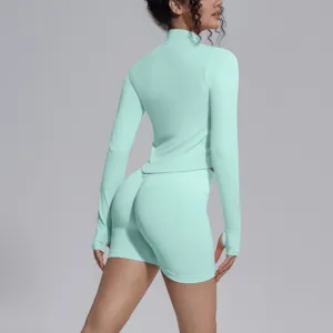 Seamless athletic long sleeve top and shorts set, back view detail showcasing fit and design.