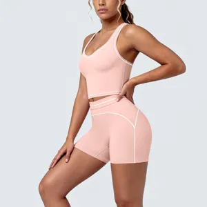Pink contrast piping activewear yoga set, detailed view of fitness crop top and shorts.