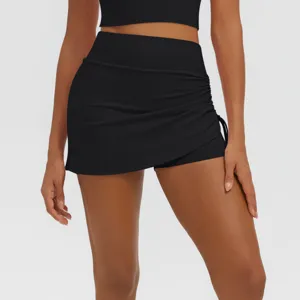 High-waist ruched black athletic yoga skirt detail, breathable activewear short for fitness.