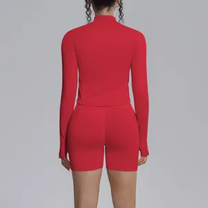 Red seamless long sleeve activewear set with a high neck crop top and matching workout shorts.