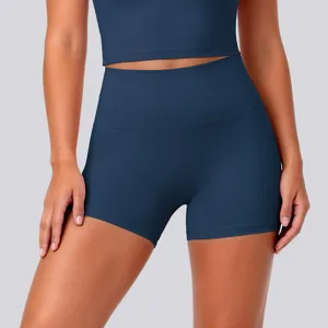 Close-up detail shot of high-waist high-stretch breathable yoga shorts in solid dark blue color.