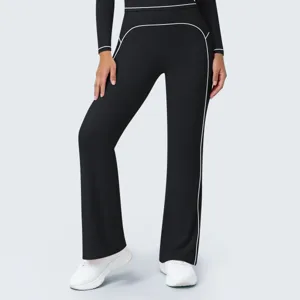 High waist black flare pants detail with white contrast piping, casual sportswear design.