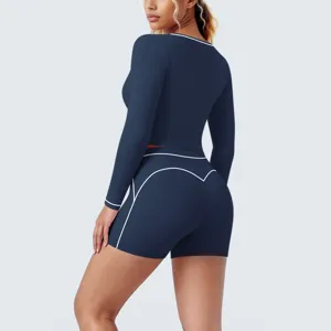 Back view of navy blue contrast long sleeve crop top and shorts yoga set for fitness training.