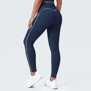 Vista detallada de leggings de yoga de talle alto para mujer en azul oscuro con líneas blancas.