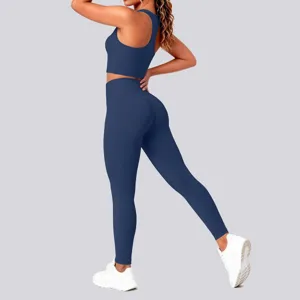 Solid dark blue sports bra and high-waist leggings set detail view, comfortable fitness activewear.