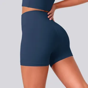 Detailed view of high-waisted blue yoga shorts, highlighting stretchy fit and soft fabric texture.