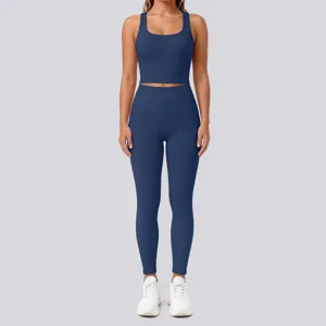 Detail view of solid color backless yoga crop top and high waist leggings fitness set.