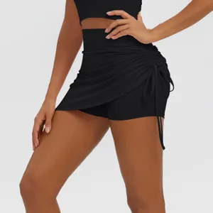 Detail shot of women black ruched sports skort high waist fitness yoga running shorts.