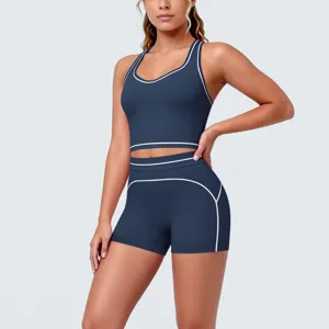 Contrast trim athletic crop top and tight shorts detail shot, flexible fitness activewear set.