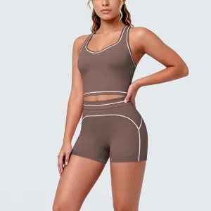 Brown contrast yoga set detail, racerback sports bra and shorts with white piping.
