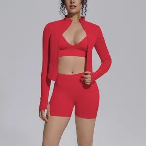 Red seamless athletic yoga 3-piece set detail view, high elastic sportswear crop top and shorts.