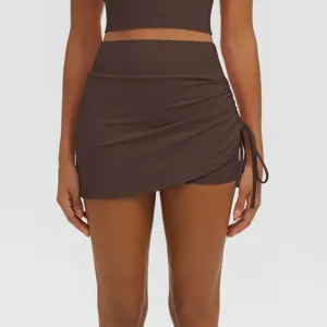 High-waisted pleated yoga skort detail, breathable fitness running workout activewear skirt.