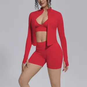 Seamless red athletic three-piece set detail view, featuring zip-up jacket, top, and shorts.