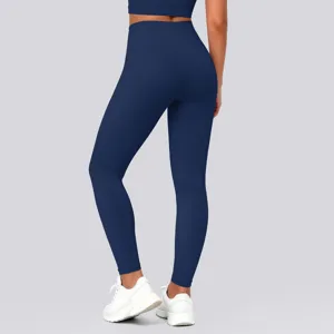 Detail view of high waist solid color push up yoga leggings in navy blue, close up fit.